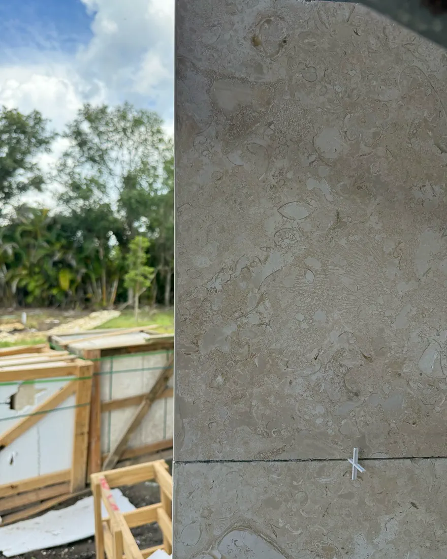 Fossil limestone cladding with tight, level joints
